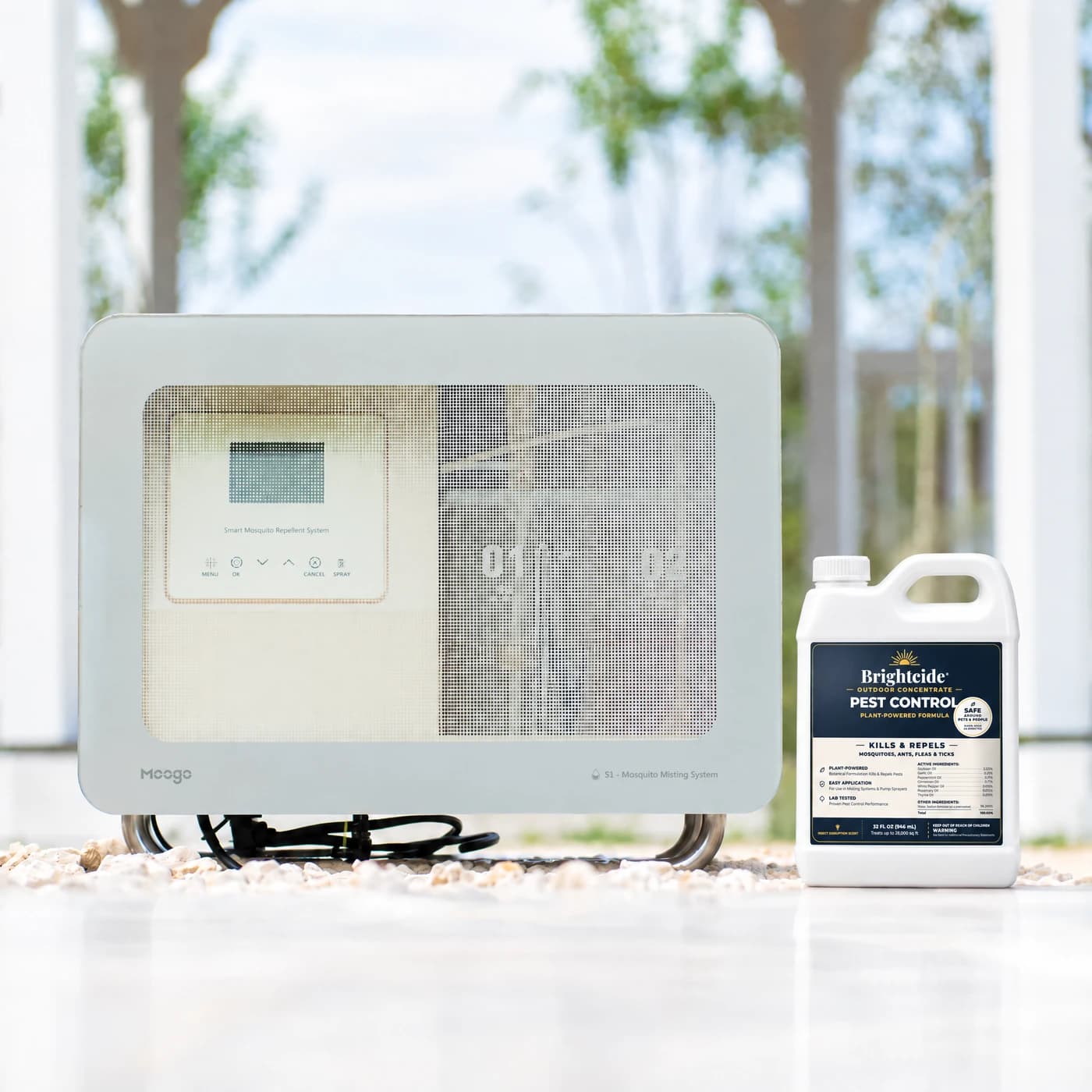 The Brightcide System smart misting unit on a patio at golden hour